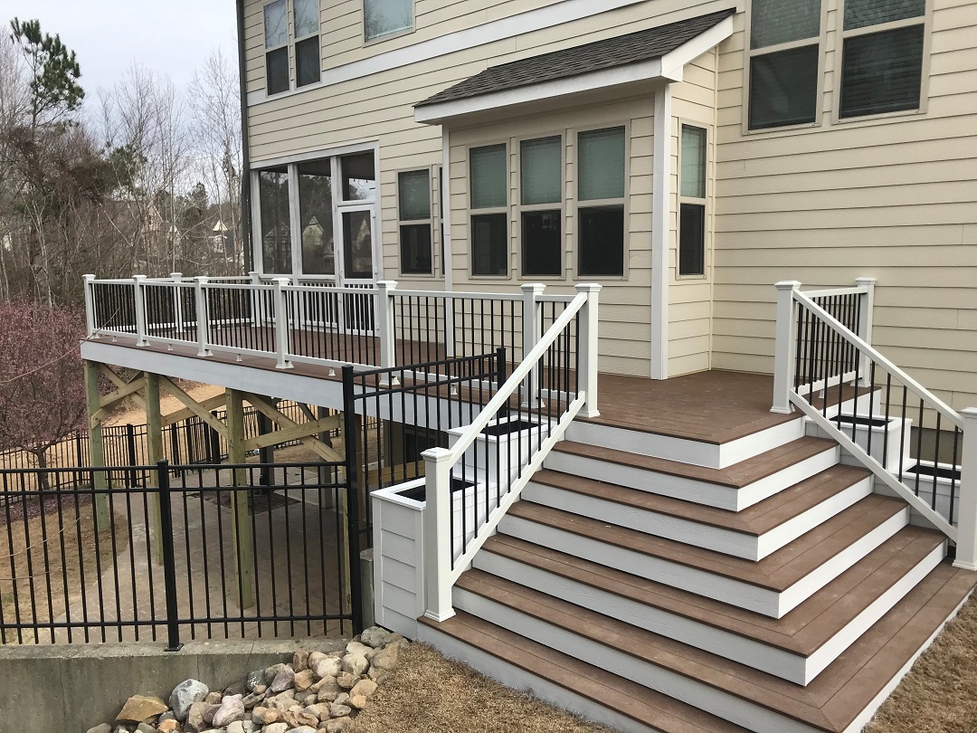 composite deck and railing with cascading steps and planter